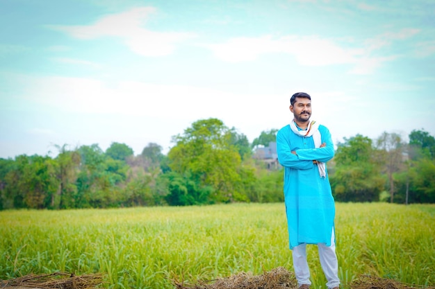 Indian farmer at sugarcane field