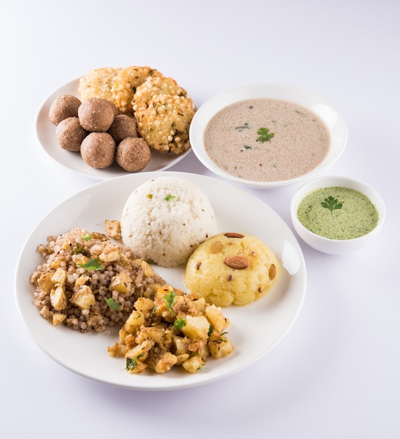 Indian Fasting Recipes or Upwas Food, for Navratri , Maha Shivratri or Ekadasi or Chaturthi or Gauri vrat. Served in ceramic crockery over colourful or wooden background. Selective focus