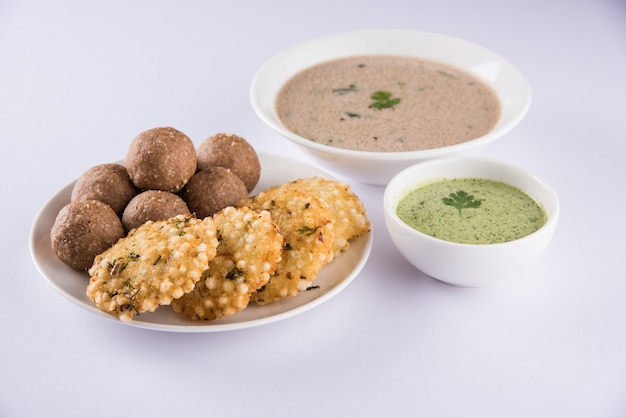 Indian Fasting Recipes or Upwas Food, for Navratri , Maha Shivratri or Ekadasi or Chaturthi or Gauri vrat. Served in ceramic crockery over colourful or wooden background. Selective focus