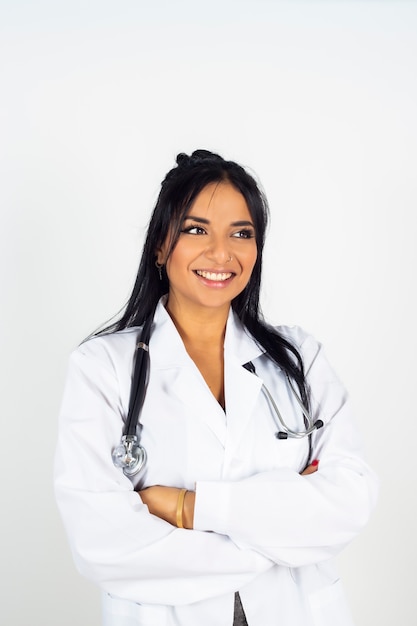 Indian female doctor smiling, on white space