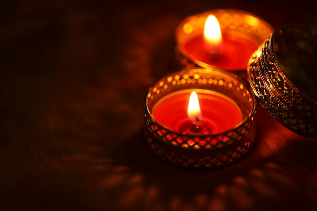 Indian festival diwali , candle on dark background