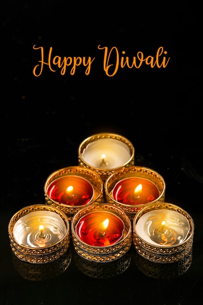 Indian festival diwali , candle on dark background