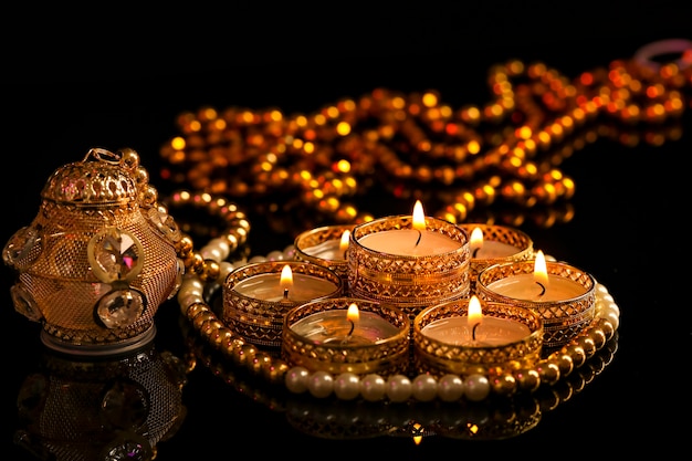 Indian festival diwali , candle on dark