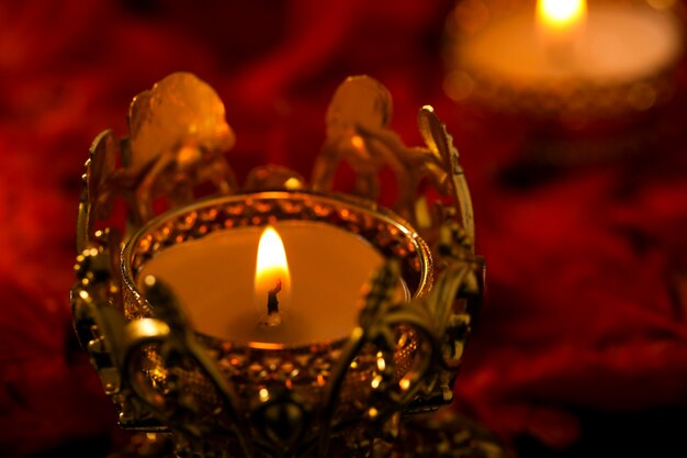 Indian festival diwali , candle on dark