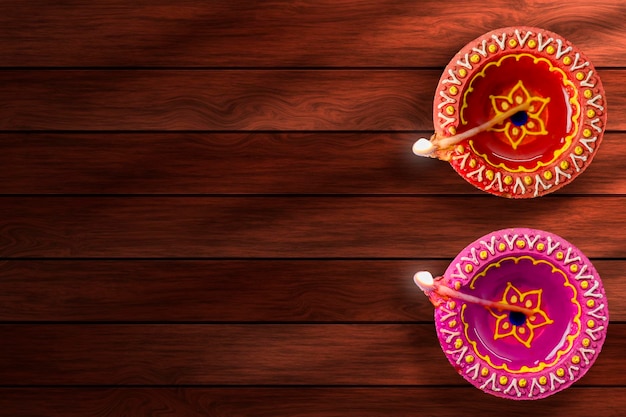 Indian Festival Diwali Diwali Lamp on wooden background with space for text