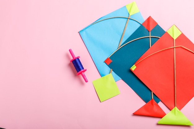 Indian festival makar sankranti concept, Colorful kite ,string and sweet sesame seed ball.