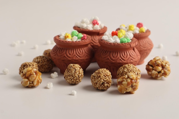 Indian festival makar sankranti concept Tilgul in small bowl Tilgul is a colourful sesame candy coated with sesame seeds in Maharashtra people exchange tilgul on Sankranti