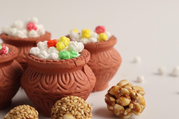 Indian festival makar sankranti concept Tilgul in small bowl Tilgul is a colourful sesame candy coated with sesame seeds in Maharashtra people exchange tilgul on Sankranti