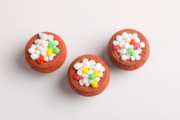 indian festival makar sankranti concept : tilgul in small bowl. tilgul is a colourful sesame candy coated with sesame seeds; in maharashtra people exchange tilgul on sankranti