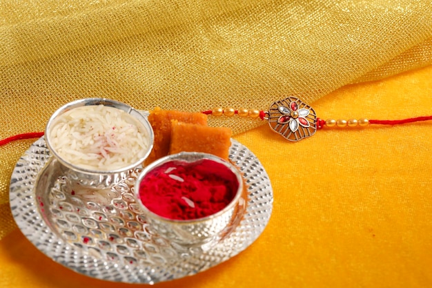 Indian festival raksha bandhan a traditional indian wrist band\
which is a symbol of love between brothers and sisters