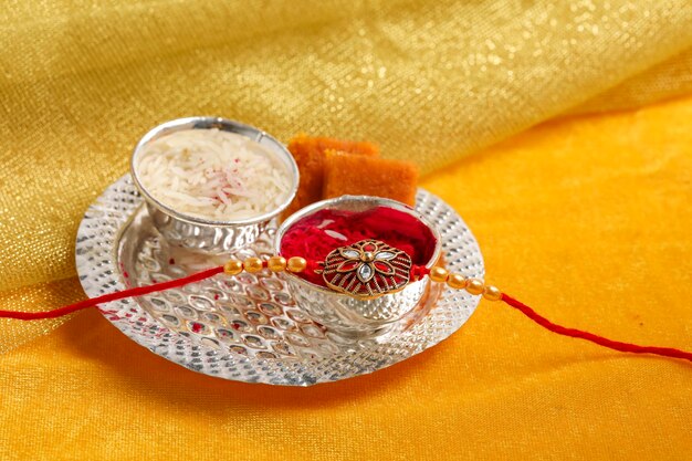 Indian festival Raksha Bandhan A traditional Indian wrist band which is a symbol of love between Brothers and Sisters