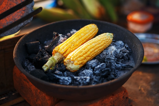 Indian food on the beach - fresh corn cobs are roasted on the coals.