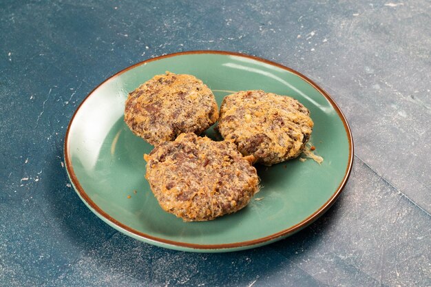 Indian food jali kabab with tomato sauce served in a dish\
isolated on background top view