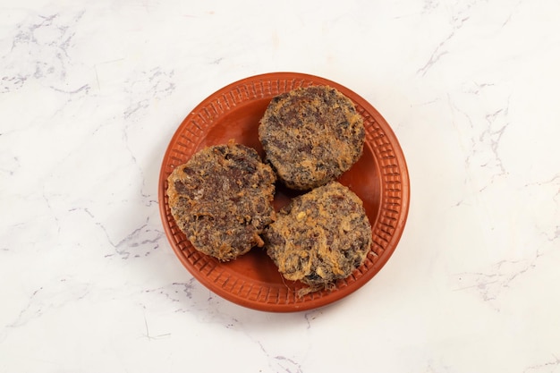 Indian food jali kabab with tomato sauce served in a dish\
isolated on background top view