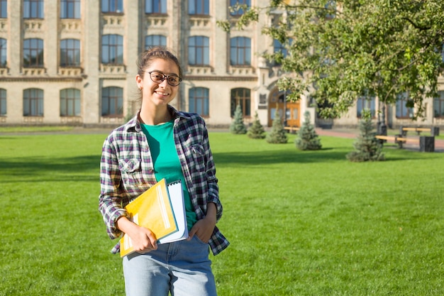 Indian girl student with books.