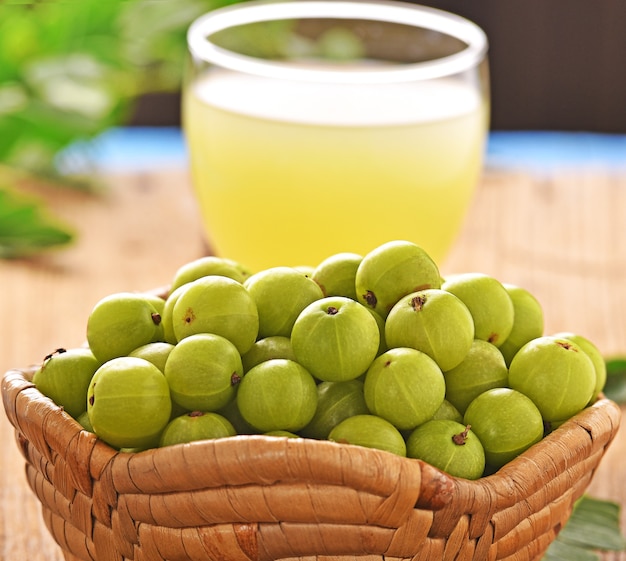 Indian gooseberry juice on wooden floor