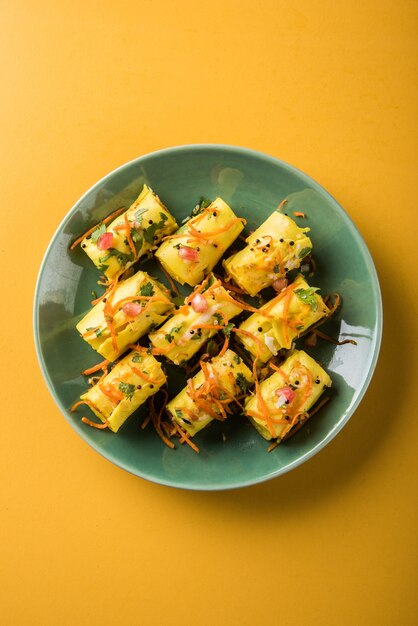 Indian gram flour snack called Khandvi or suralichya vadya, selective focus