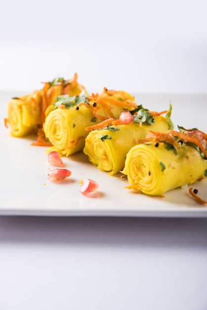 Indian gram flour snack called Khandvi or suralichya vadya, selective focus