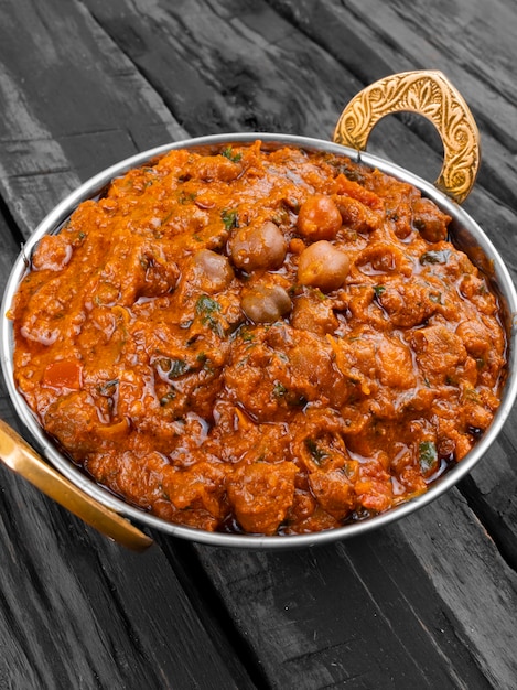 indian healthy cuisine chana masala on wooden background
