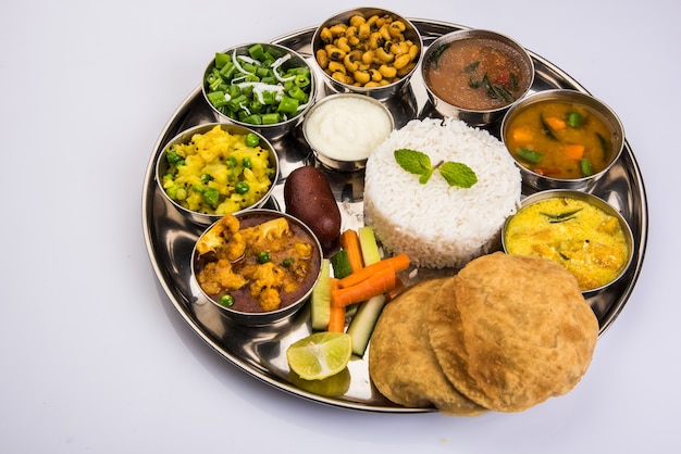 Indian or Hindu Veg Thali also known as Food platter is a complete Lunch or Dinner Meal, Closeup, selective focus