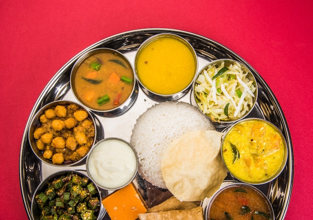 Indian or Hindu Veg Thali or Restaurant style complete Food platter for Lunch or Dinner. Closeup, selective focus