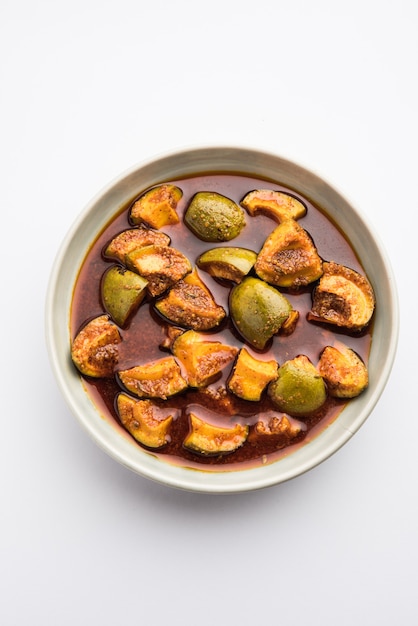 Indian Homemade Raw Mango Pickle or aam ka achar or Kairi Loncha in a bowl