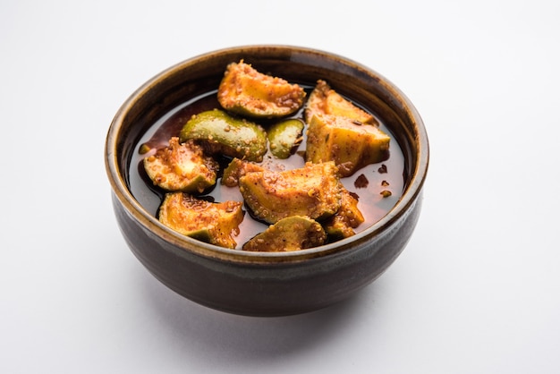 Premium Photo | Indian homemade raw mango pickle or aam ka achar or kairi loncha in a bowl Premium Photo | Indian homemade raw mango pickle or aam ka achar or kairi loncha in a bowl