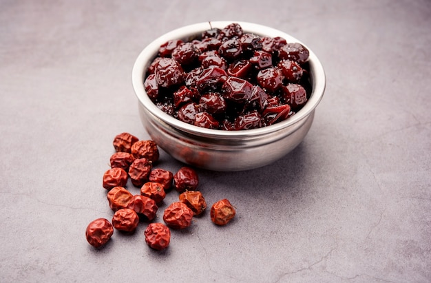 Indian jujube, berry or ber boiled in jaggery syrup with sweet and sour taste called Labdo, typical road side seasonal snack food