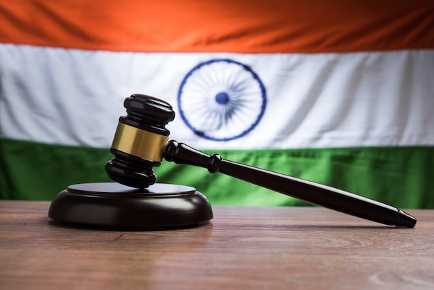 Indian Law concept showing wooden Gavel and Indian Flag