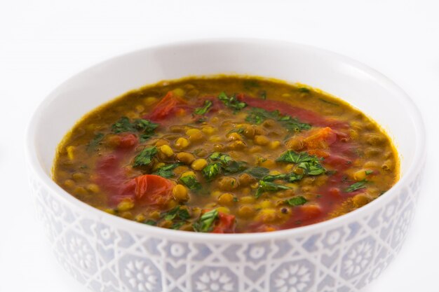 Indian lentil soup dal in a bowl isolated