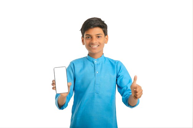 Indian little child in traditional wear and showing smartphone