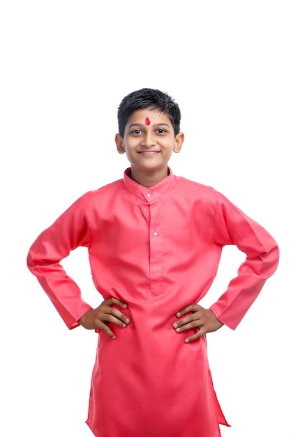 Indian little child in traditional wear on white background.