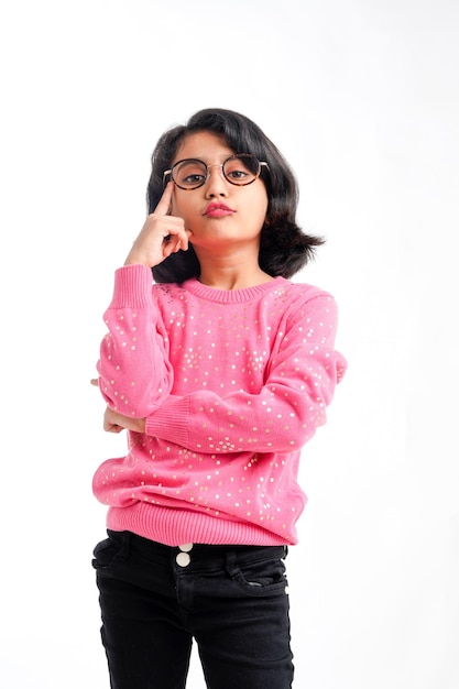 Indian little girl wearing eyeglass and giving expression