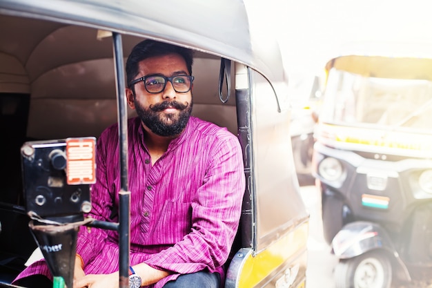 Indian man in auto rickshaw