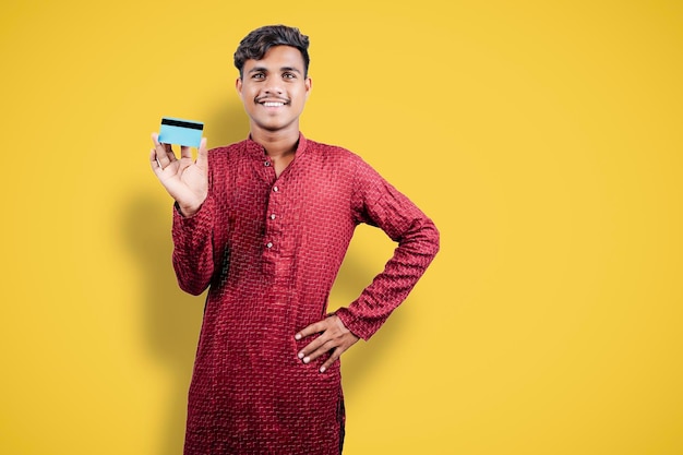 Indian man holding bank card or business card