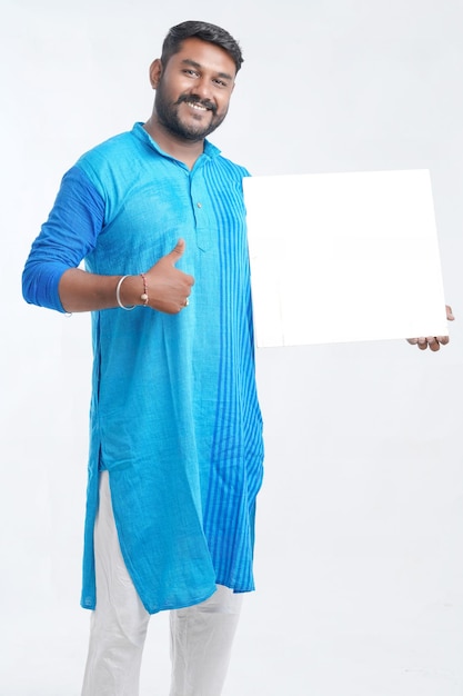 Indian man holding white board