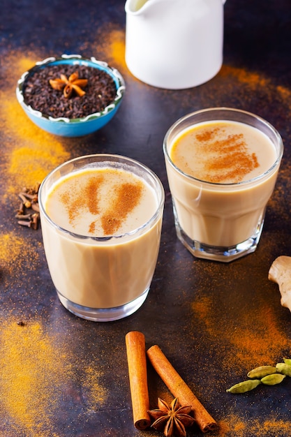 Indian masala chai tea with spices in cups