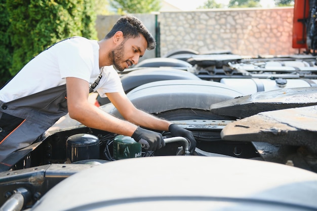 Indian Mechanic repairing the truck