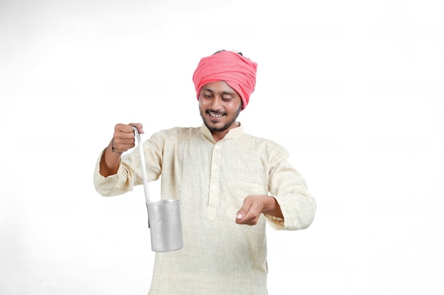 Indian milk man giving expression on white background.