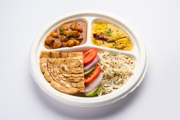 Indian mini meal parcel platter combo thali with chole Masala roti dal tarka jeera rice salad