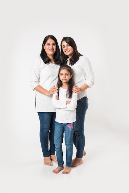 Indian moyther daughter standing isolated on white background