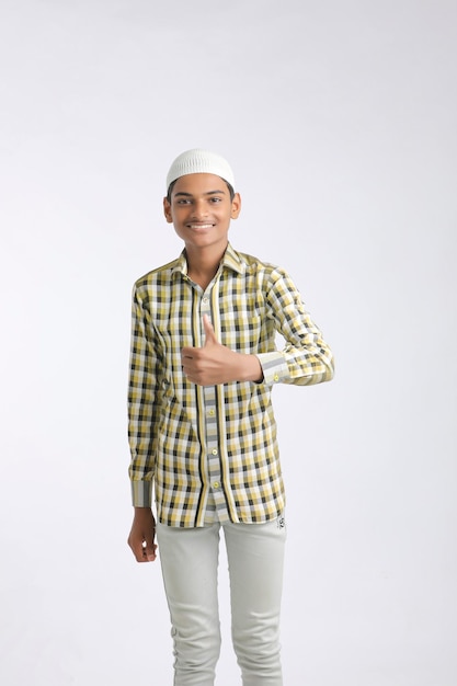 Indian muslim boy giving expression on white background