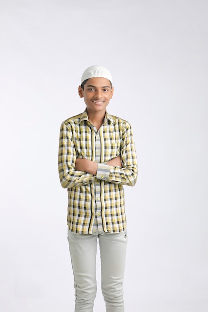 Indian muslim boy giving expression on white background