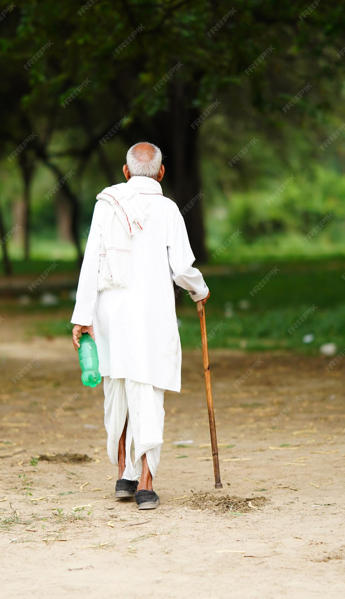 Premium Photo Indian Old Man Walking With A Stick premium-photo-indian-old-man-walking-with-a-stick