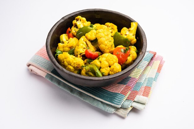 Indian phool Gobi Shimla Mirch Sabji Recipe or Capsicum Cauliflower Sabzi a healthy and homemade dry vegetable dish