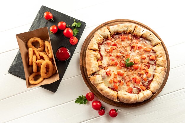 Indian pizza on a white background with snacks indian fast food set