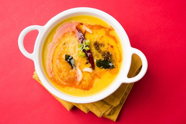 Indian popular food Dal fry or traditional Dal Tadka Curry served in a bowl, isolated over white background, selective focus