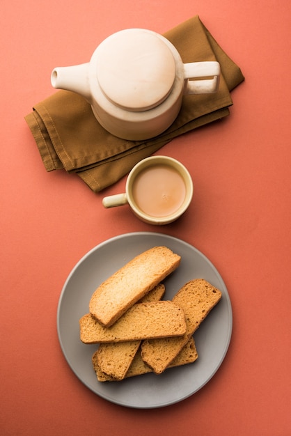 Indian punjabi or Delhi bread or tutti fruitti flavoured toast, served with indian hot tea, selective focus texture