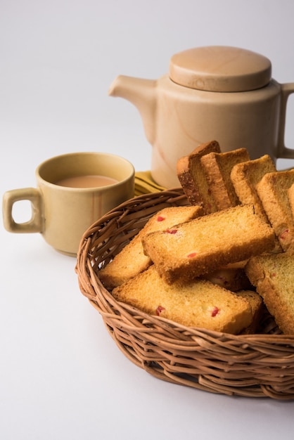 Indian punjabi or Delhi bread or tutti fruitti flavoured toast, served with indian hot tea, selective focus texture