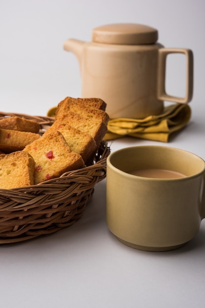 Indian punjabi or Delhi bread or tutti fruitti flavoured toast, served with indian hot tea, selective focus texture